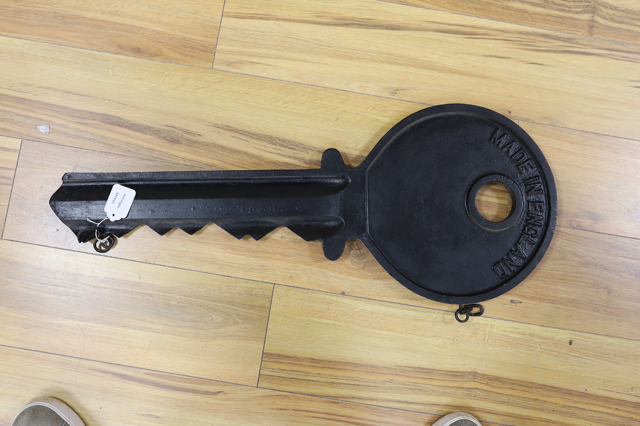 An oversized cast metal Yale advertising key. 78cm long